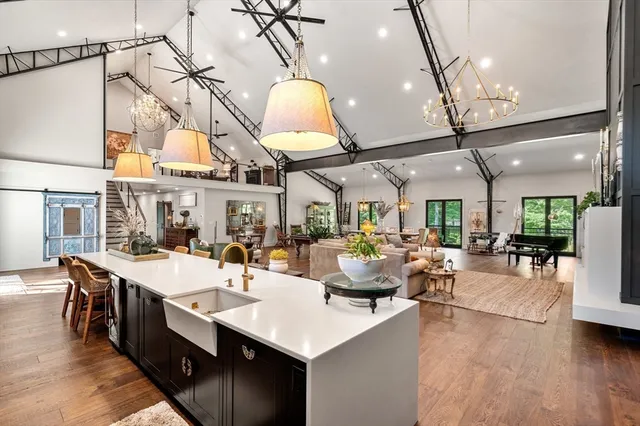 a dining table chairs and a chandelier