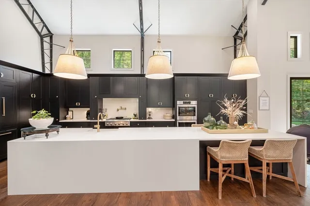 a kitchen with a table and chairs