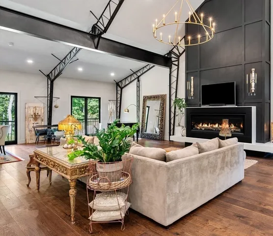 a living room with furniture fireplace and flat screen tv