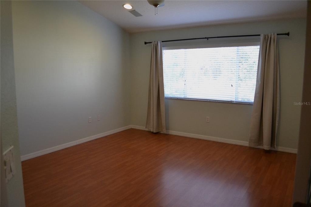 11235 Kapok Grand Circle Madeira Beach, FL 33708 - Photo 10 of 34 an empty room with a window