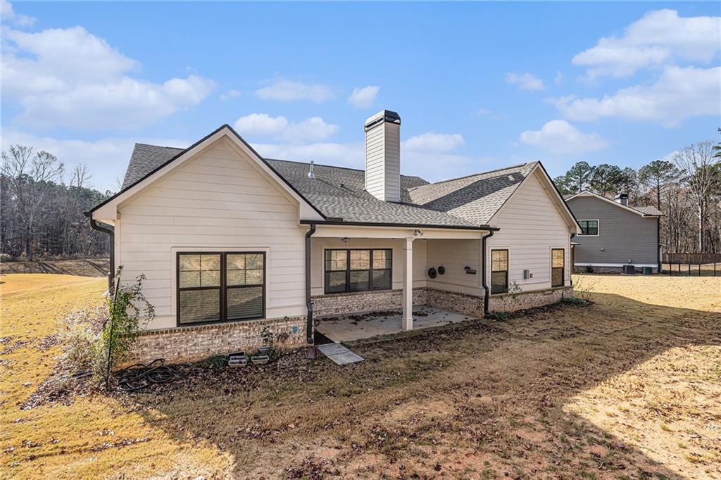 1119 Heights View Way Monroe, GA 30655 - Photo 29 of 30 a view of a house with a yard