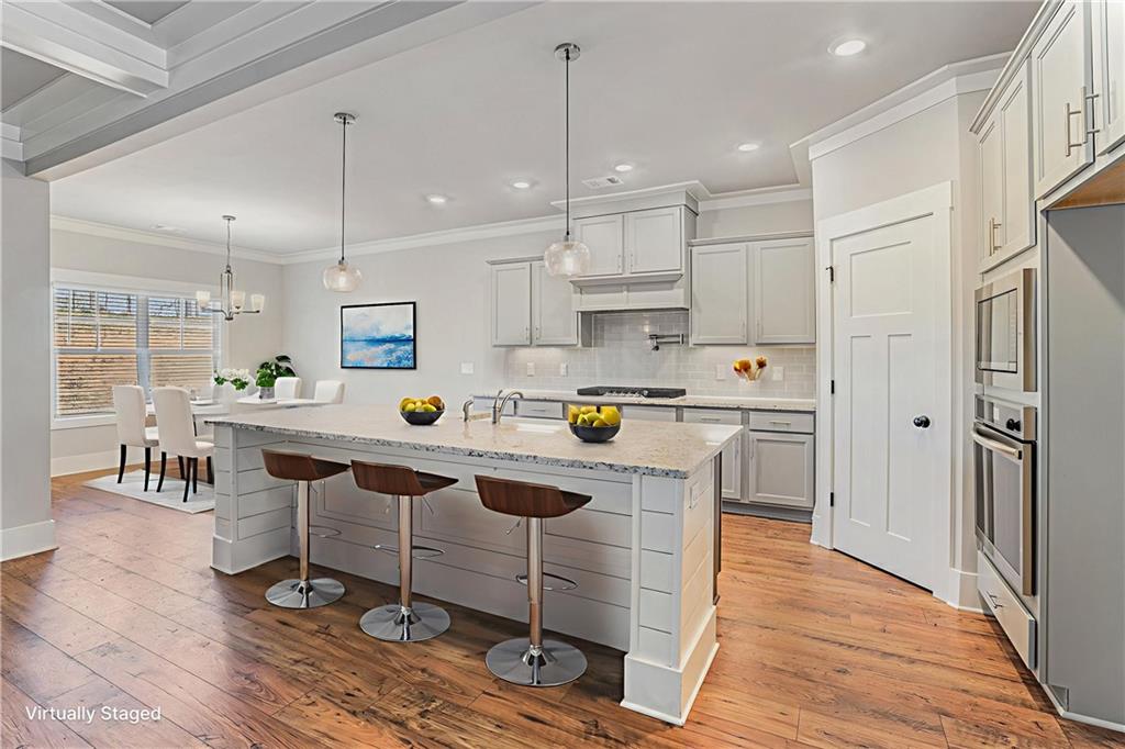 1119 Heights View Way Monroe, GA 30655 - Photo 6 of 30 a kitchen that has a lot of cabinets in it and appliances