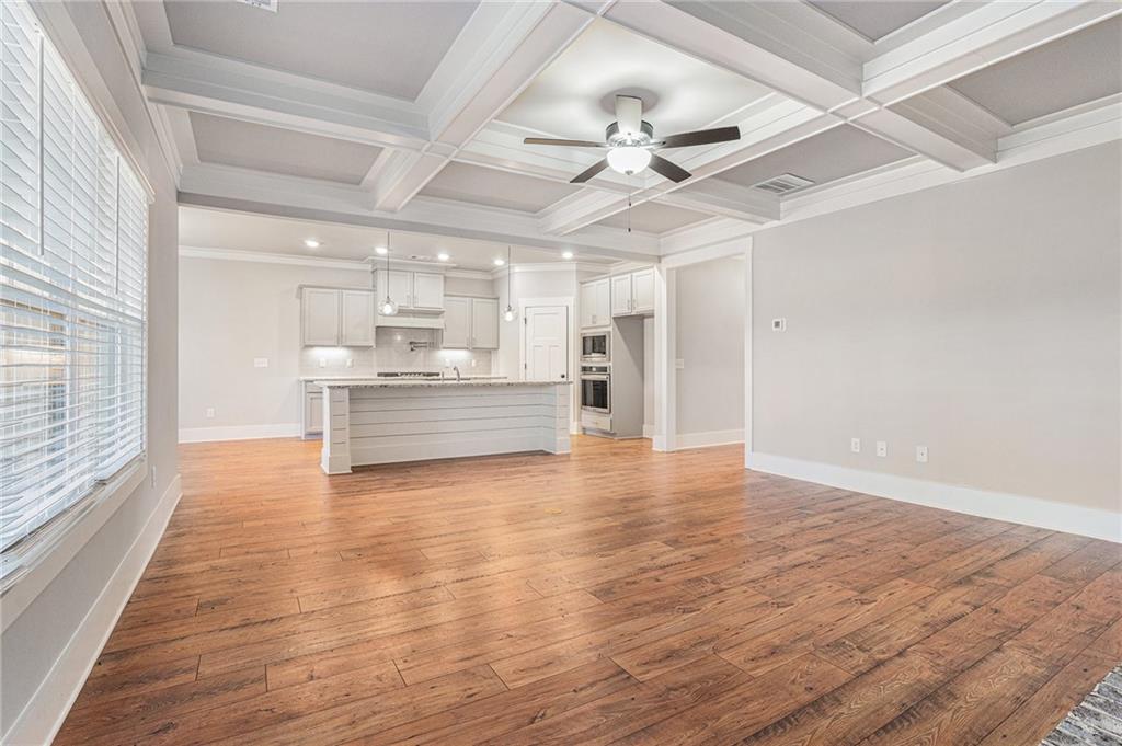 1119 Heights View Way Monroe, GA 30655 - Photo 10 of 30 a view of a kitchen with a stove cabinets and wooden floor