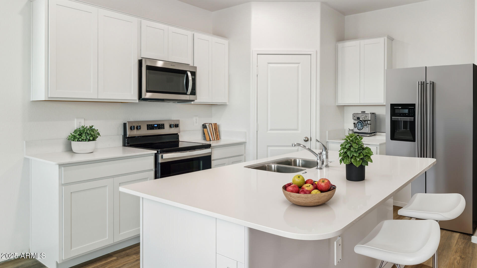 18401 West Hackamore Drive Wittmann, AZ 85361 - Photo 3 of 22 a kitchen with stainless steel appliances a microwave a sink and refrigerator