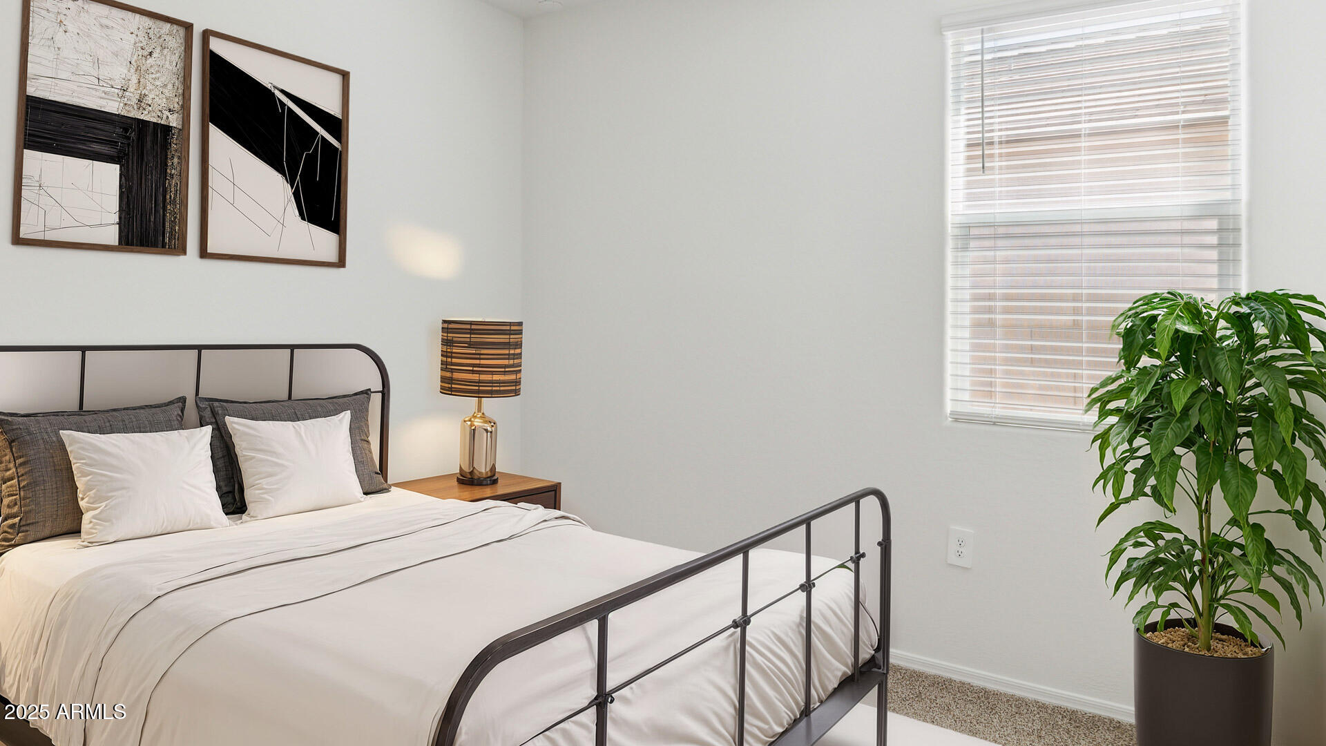 18401 West Hackamore Drive Wittmann, AZ 85361 - Photo 8 of 22 a bedroom with a bed and a potted plant