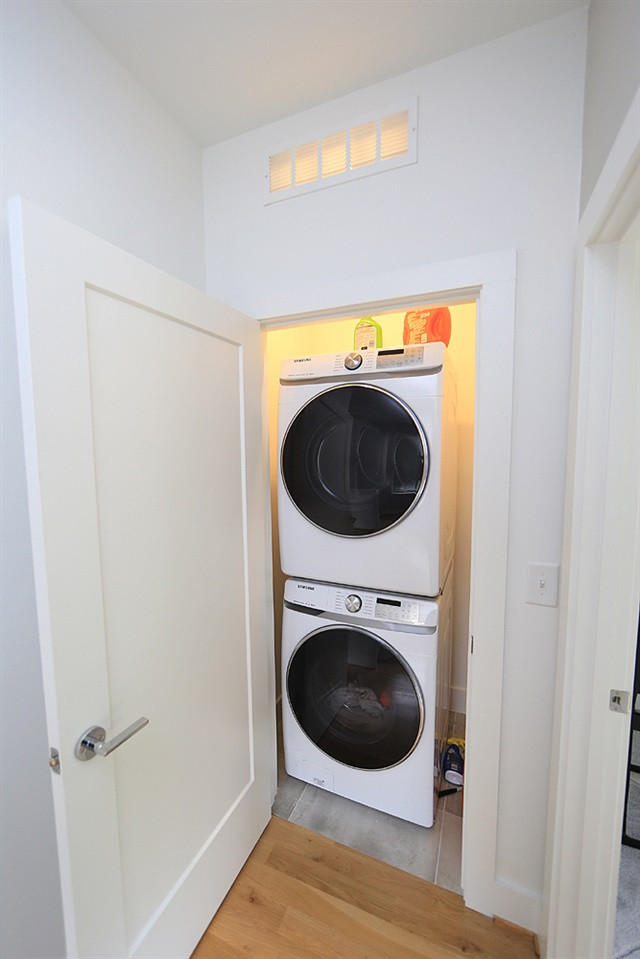 211 South Pettigrew Street Raleigh, NC 27610 - Photo 26 of 29 Laundry closet with stack washer and dryer. Laundry
