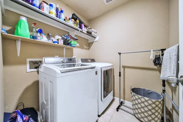 a utility room with dryer and washer