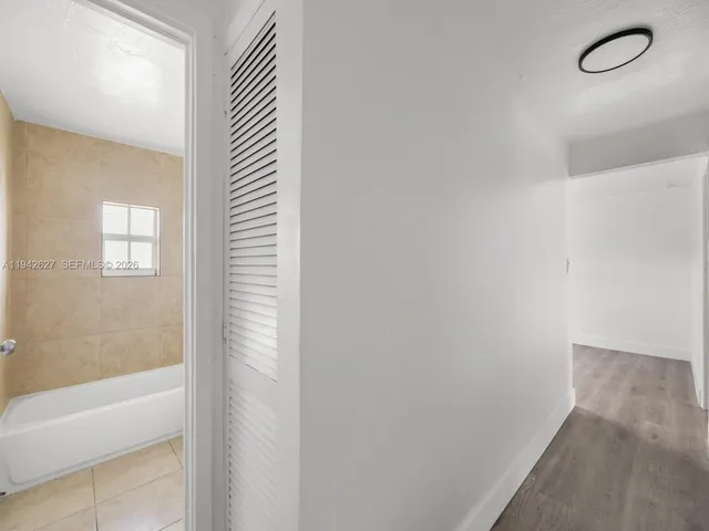 a bathroom with a bathtub and shower