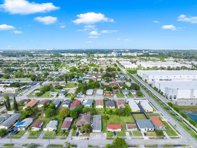 an aerial view of residential building and lake