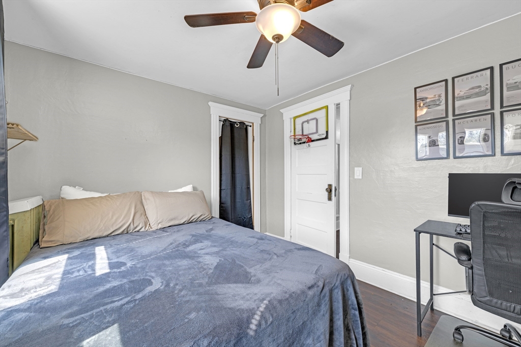 29 Sterling Street Springfield, MA 01107 - Photo 21 of 38 a bedroom with a bed chandelier and a window