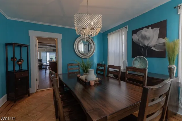 a living room with furniture and a mirror