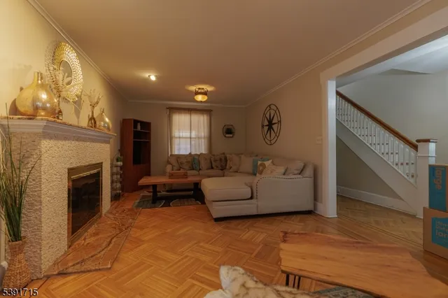 a living room with furniture and a fireplace
