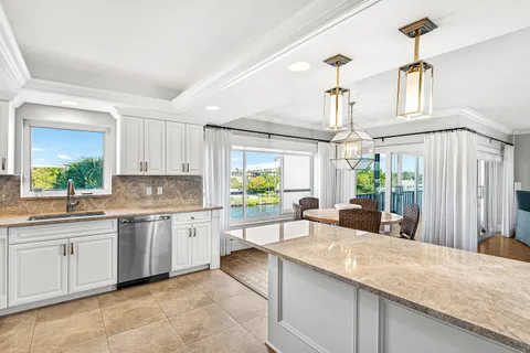 a view of a living room with a sink and a window