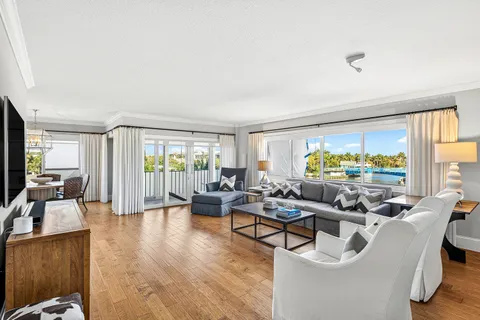 a bedroom with a large window and a bed