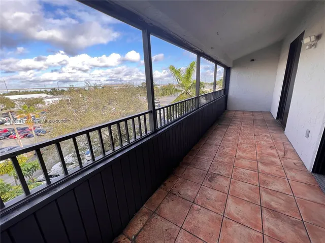 a view of balcony with furniture