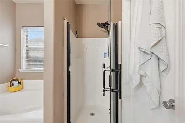 a white bath tub sitting next to a window