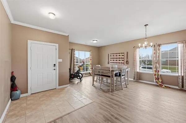 a view of a dining room with furniture window and outside view