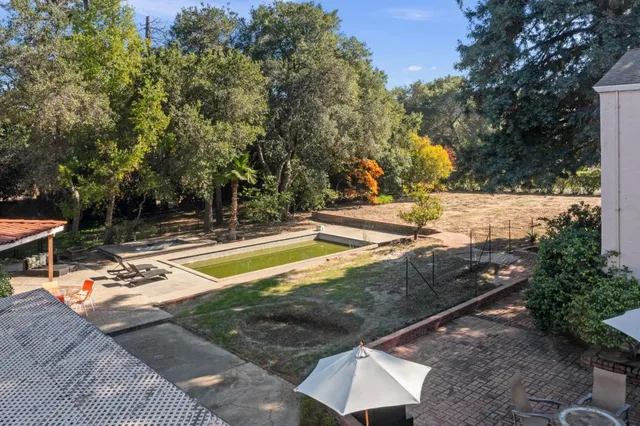 a view of a swimming pool with a patio