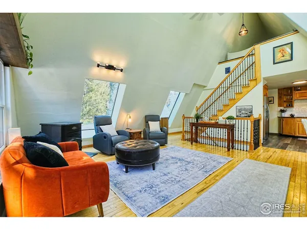 a living room with furniture and a rug