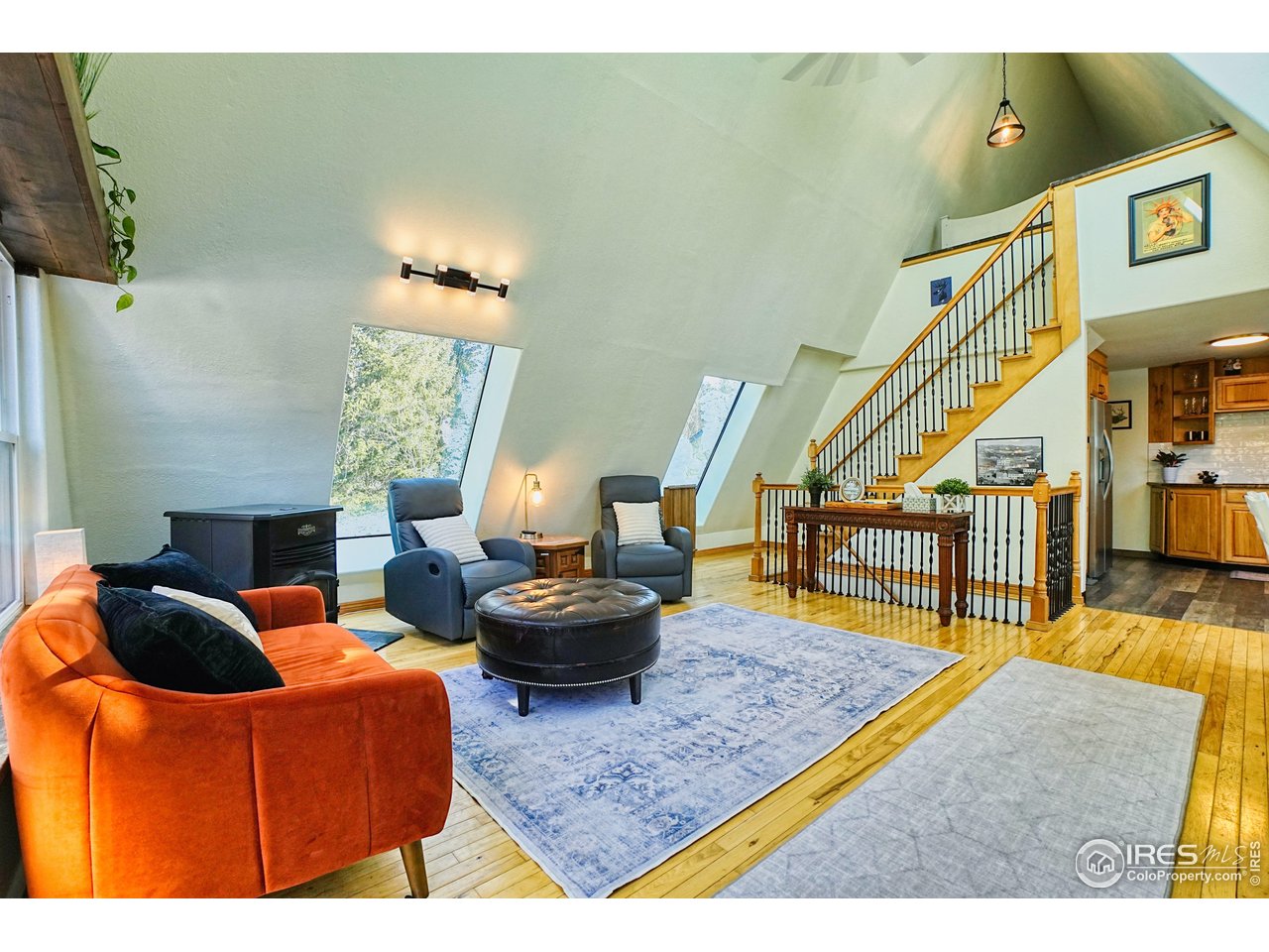 a living room with furniture and a rug