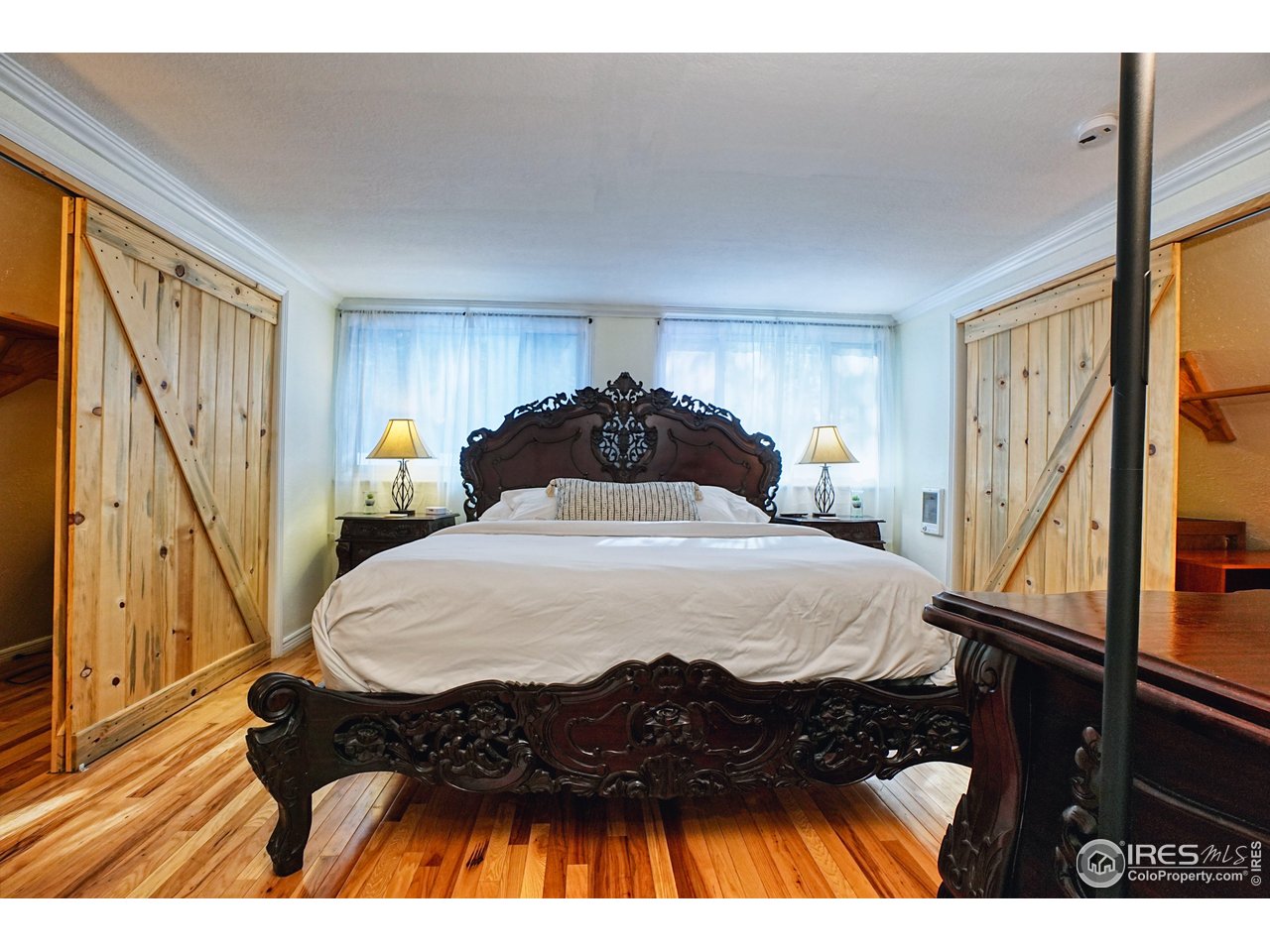 2170 Apex Valley Road Black Hawk, CO 80422 - Photo 22 of 50 a bedroom with a bed and a dresser