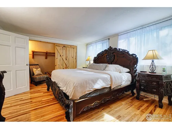 a living room with a couch and a potted plant