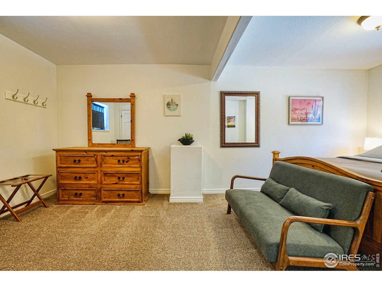 2170 Apex Valley Road Black Hawk, CO 80422 - Photo 30 of 50 a bedroom with a bed and furniture