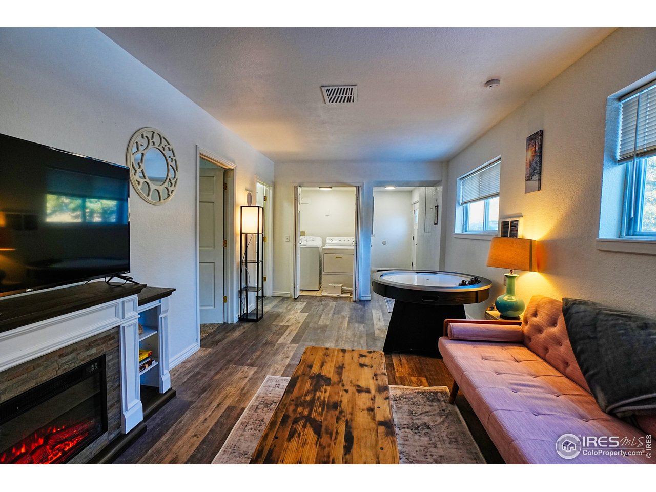 2170 Apex Valley Road Black Hawk, CO 80422 - Photo 33 of 50 a living room with furniture and a flat screen tv
