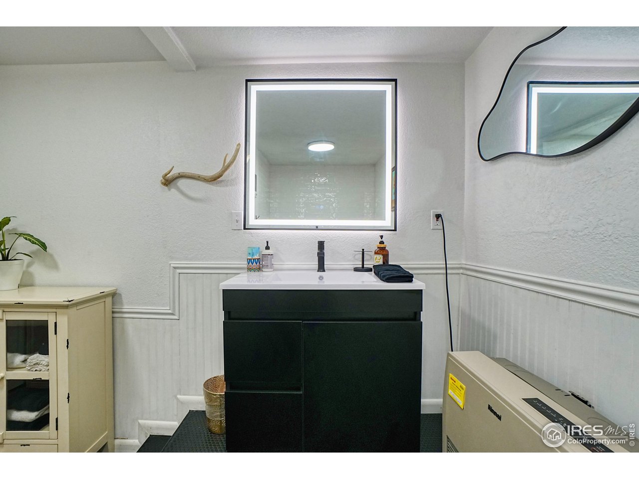 2170 Apex Valley Road Black Hawk, CO 80422 - Photo 36 of 50 a bathroom with a sink and a mirror