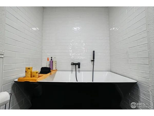 a bedroom with a bed and cabinets