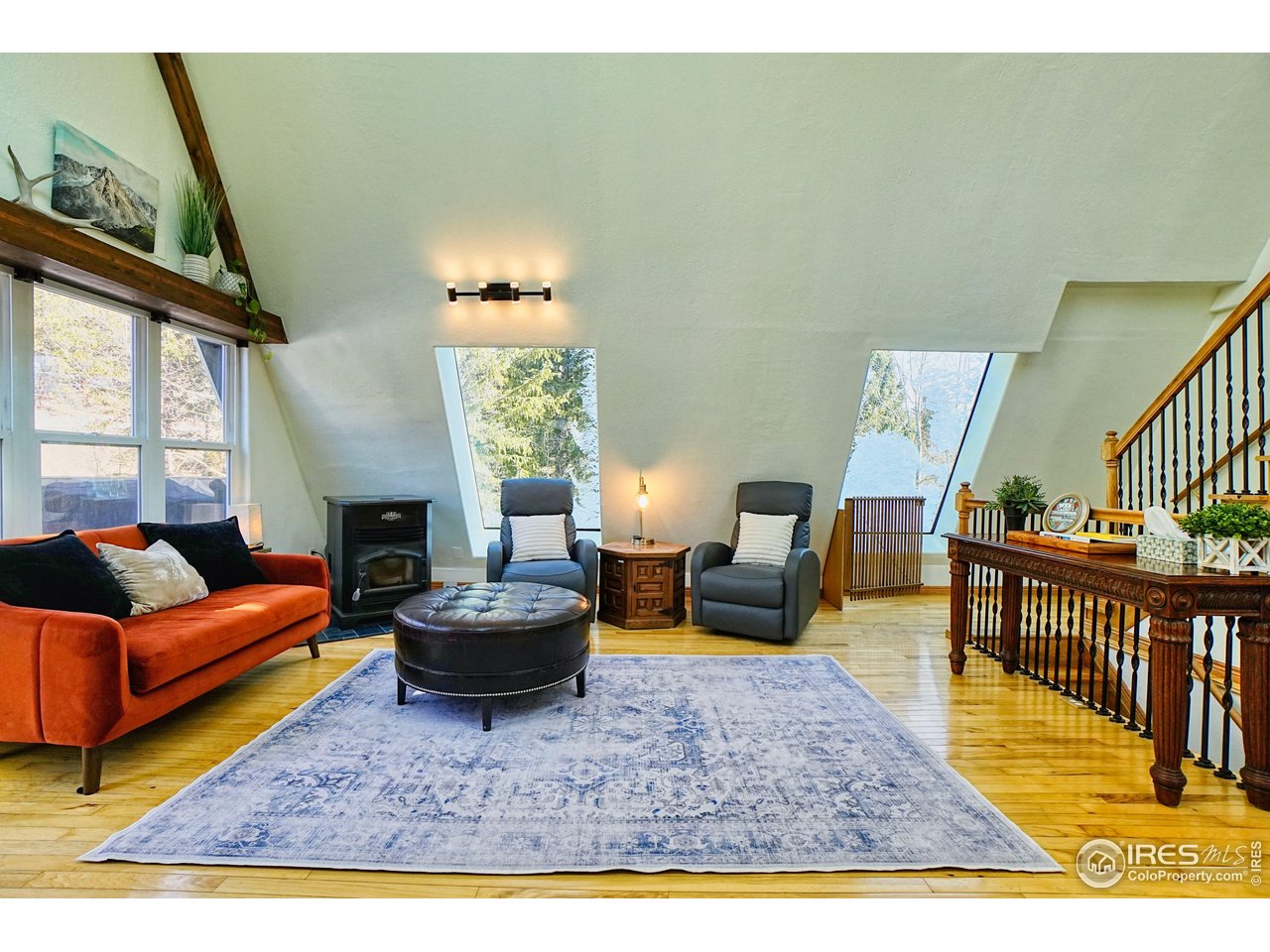 2170 Apex Valley Road Black Hawk, CO 80422 - Photo 4 of 50 a living room with furniture a rug and a window