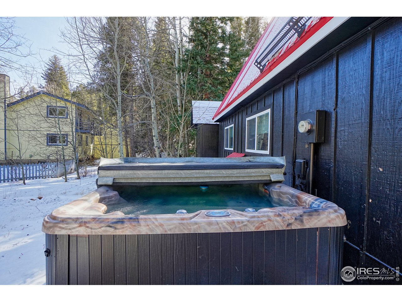 2170 Apex Valley Road Black Hawk, CO 80422 - Photo 43 of 50 a backyard of a house with table and chairs