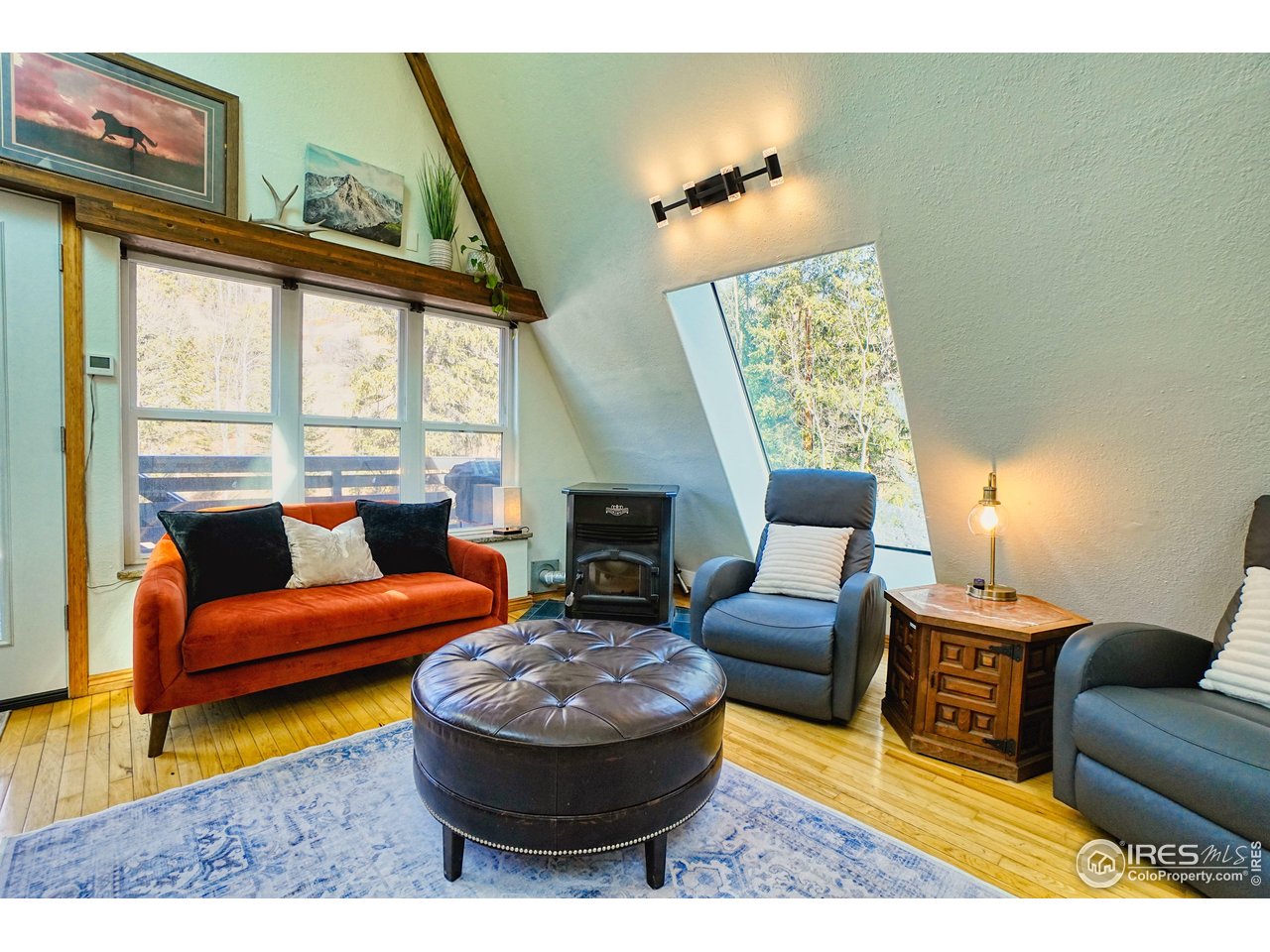 2170 Apex Valley Road Black Hawk, CO 80422 - Photo 7 of 50 a living room with furniture and a large window