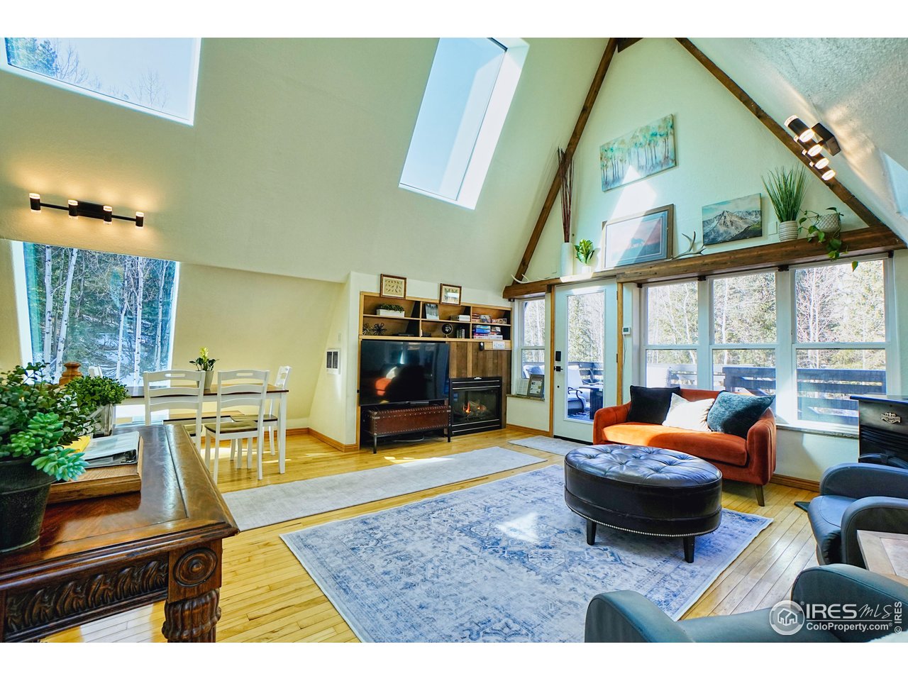 2170 Apex Valley Road Black Hawk, CO 80422 - Photo 8 of 50 a living room with furniture a rug and a large window