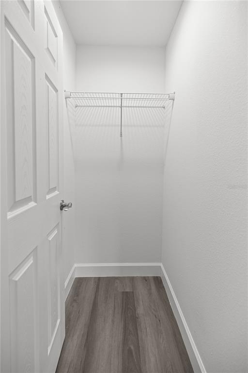 8607 Southwest 135th Street Road Ocala, FL 34473 - Photo 15 of 30 a view of a room with wooden floor