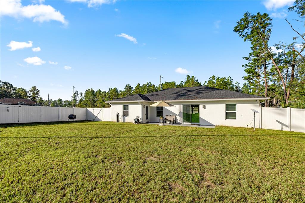 8607 Southwest 135th Street Road Ocala, FL 34473 - Photo 21 of 30 a house view with a garden space