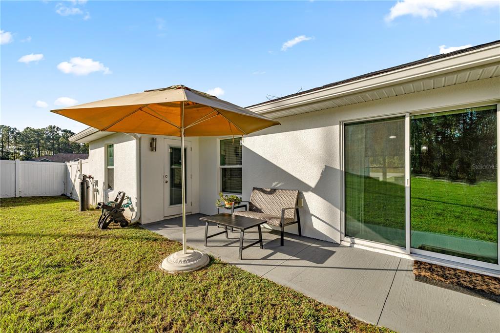 8607 Southwest 135th Street Road Ocala, FL 34473 - Photo 24 of 30 a view of a lounge chairs in the patio
