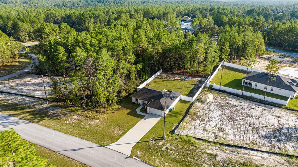 8607 Southwest 135th Street Road Ocala, FL 34473 - Photo 29 of 30 a view of a backyard with chairs