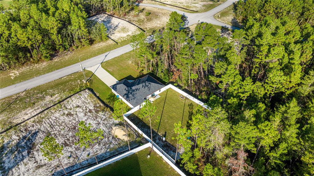 8607 Southwest 135th Street Road Ocala, FL 34473 - Photo 30 of 30 a view of a yard with potted plants