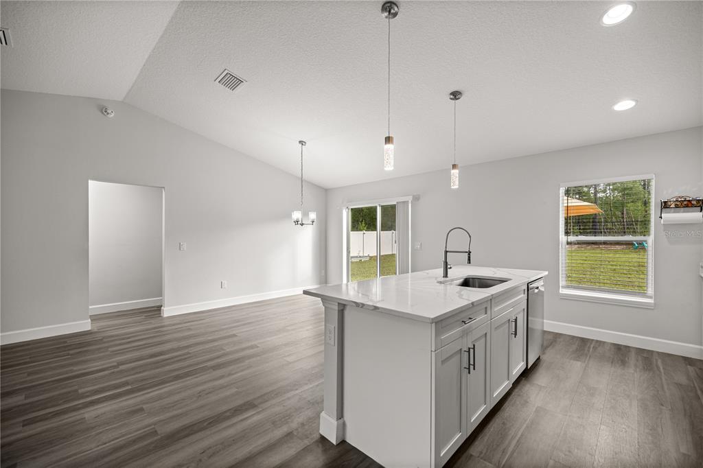 8607 Southwest 135th Street Road Ocala, FL 34473 - Photo 8 of 30 a kitchen with a sink and window