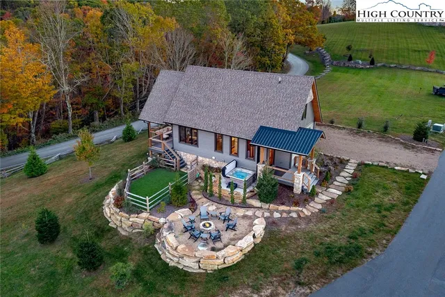 an aerial view of a house with outdoor space