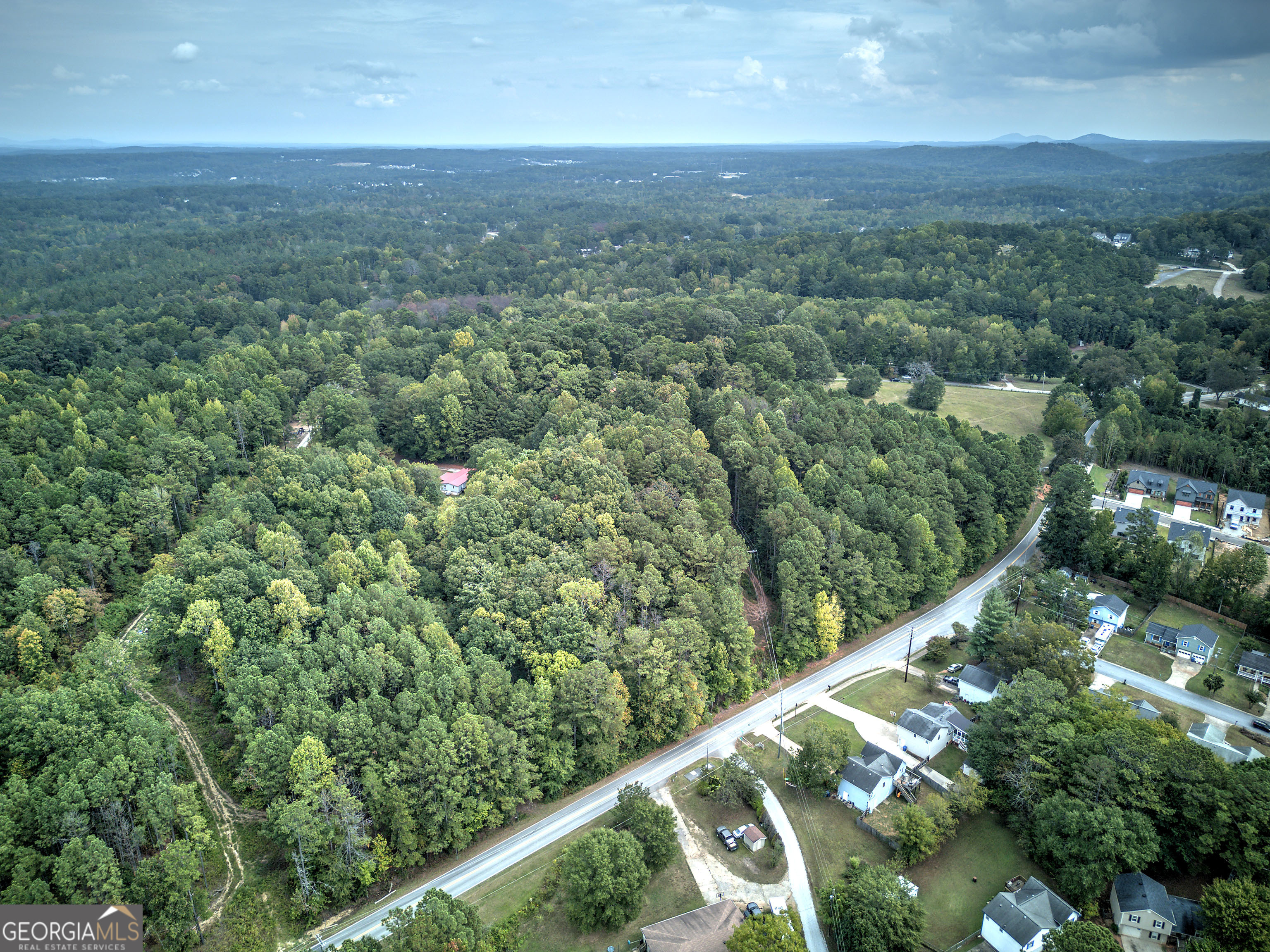 67 Polk Lane Dallas, GA 30132 - Photo 21 of 51 an aerial view of residential houses with outdoor space and trees
