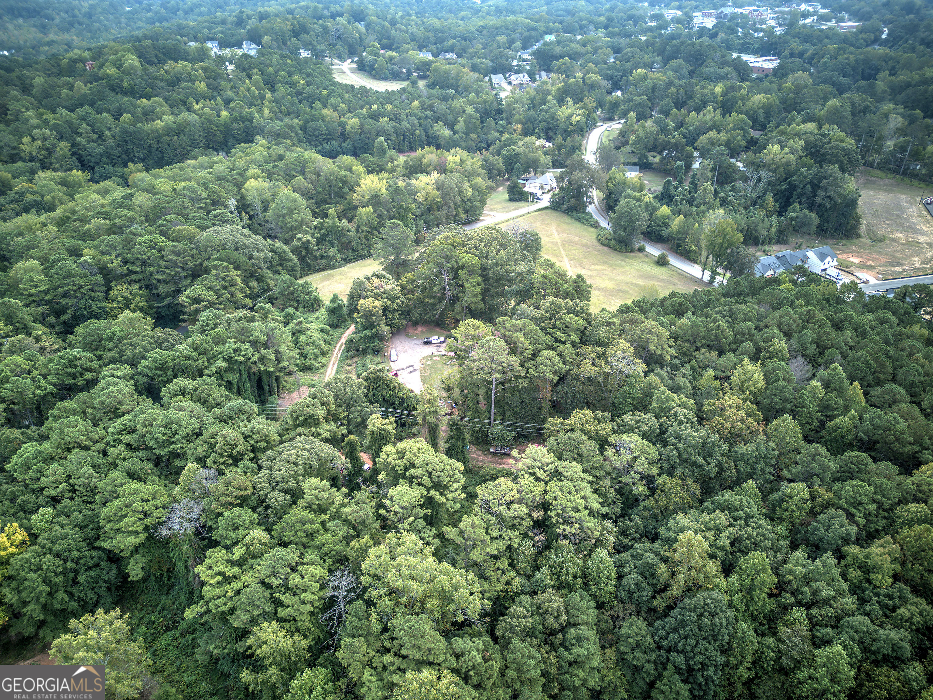 67 Polk Lane Dallas, GA 30132 - Photo 22 of 51 an aerial view of residential houses with outdoor space and trees