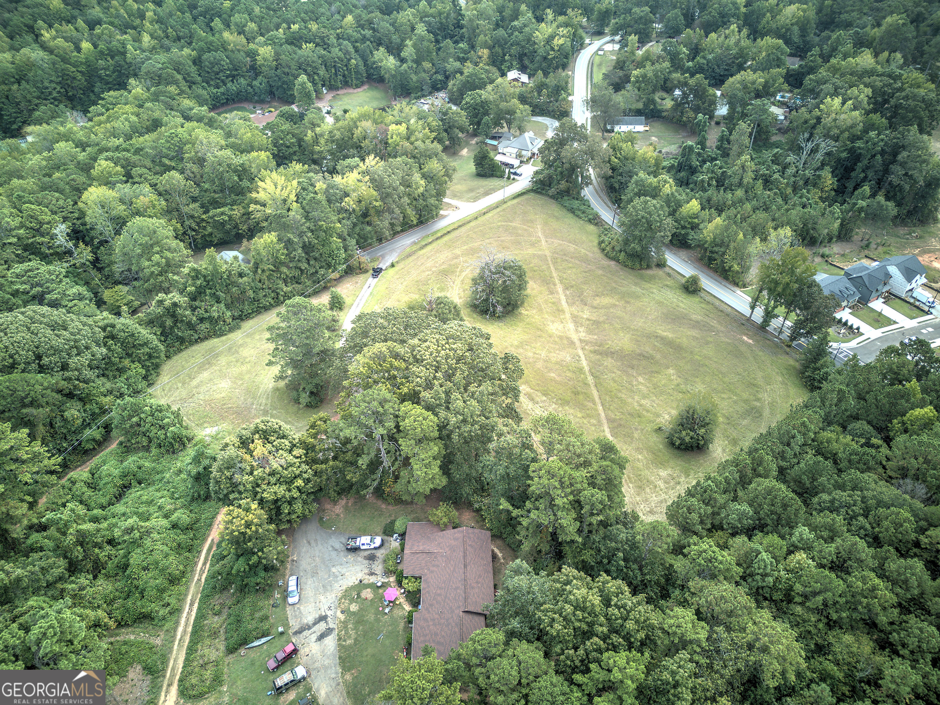 67 Polk Lane Dallas, GA 30132 - Photo 25 of 51 an aerial view of residential house with outdoor space and trees all around