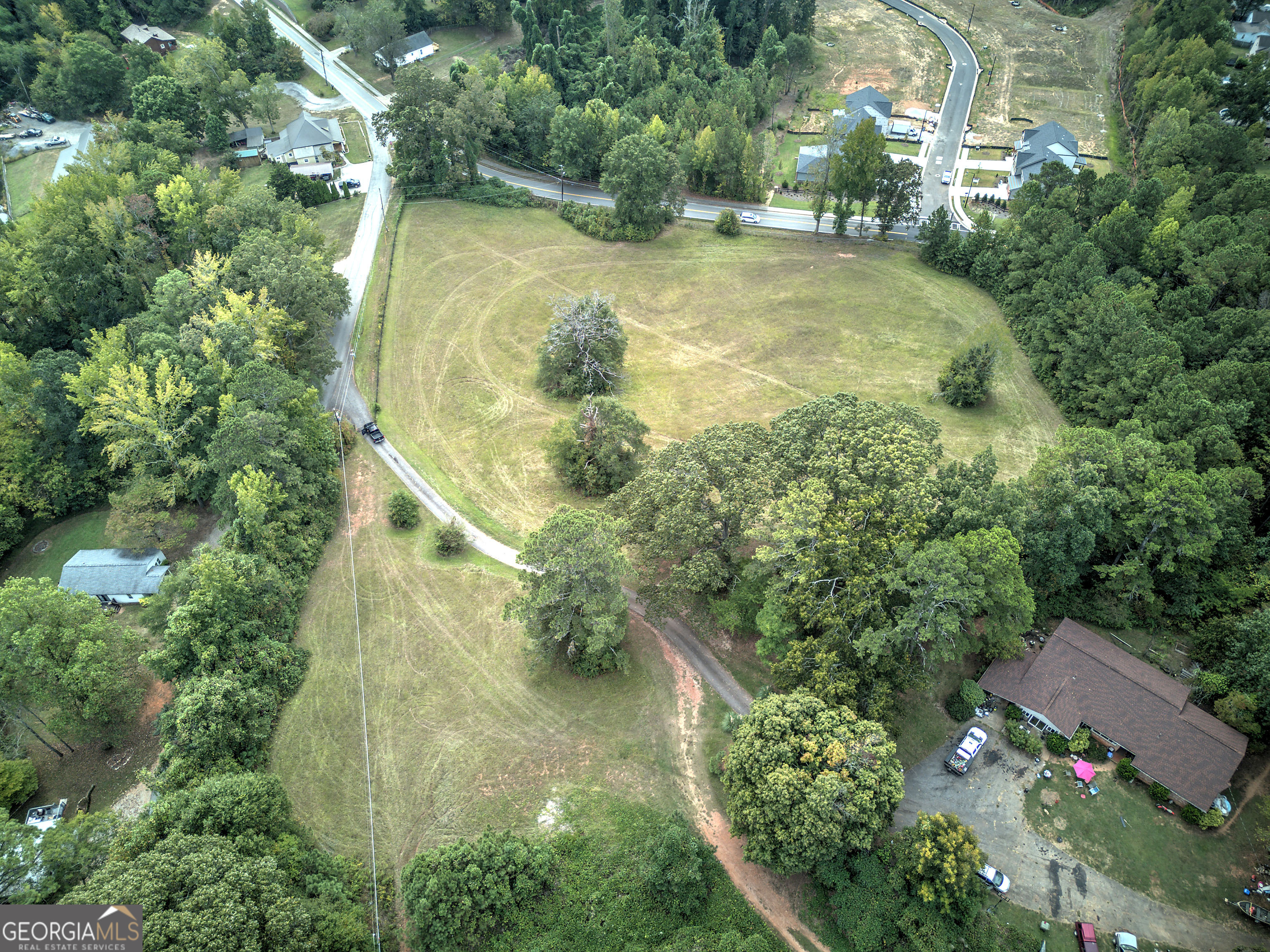 67 Polk Lane Dallas, GA 30132 - Photo 27 of 51 an aerial view of residential house with outdoor space and trees all around