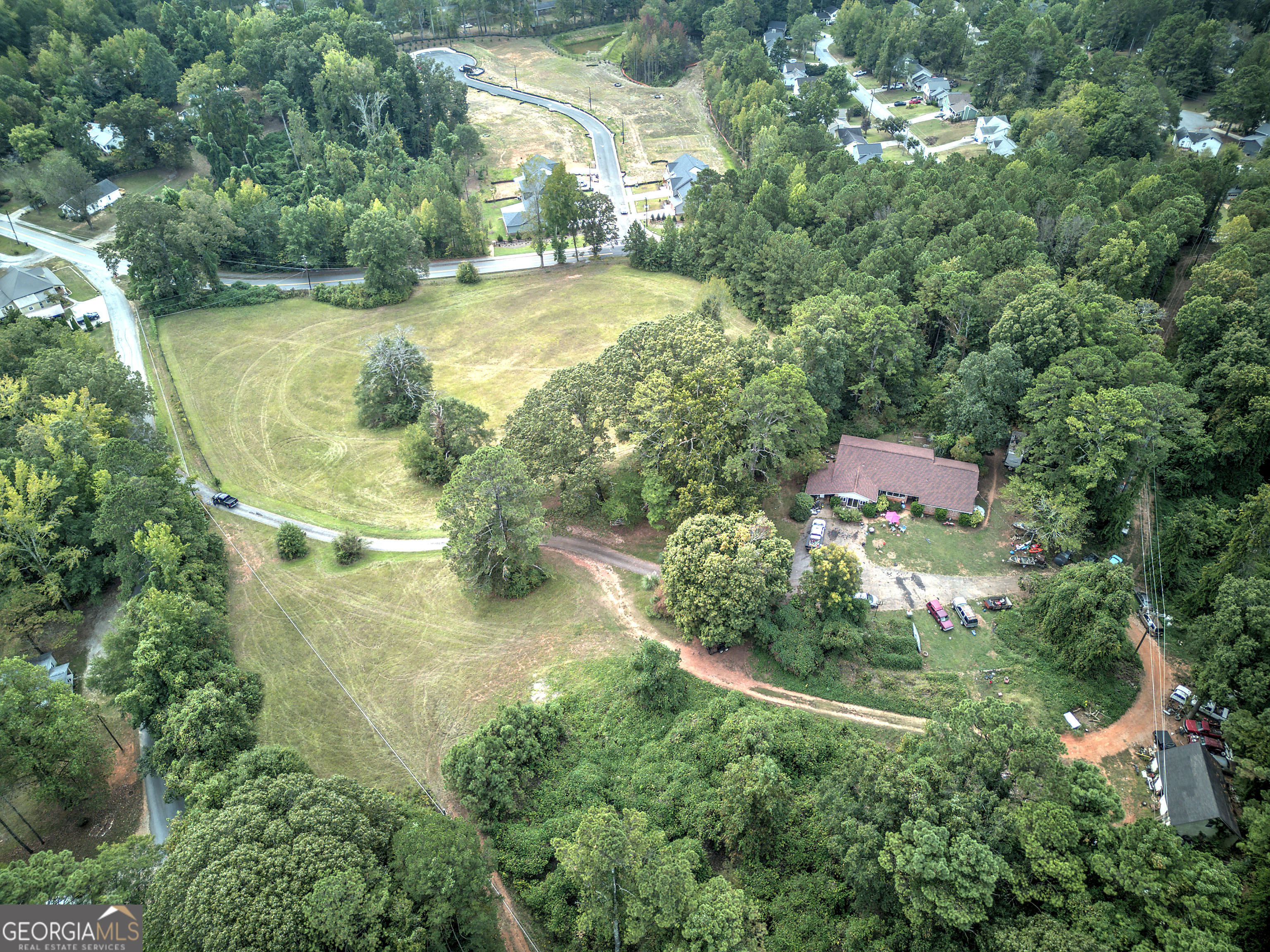 67 Polk Lane Dallas, GA 30132 - Photo 28 of 51 an aerial view of residential house with outdoor space and trees all around