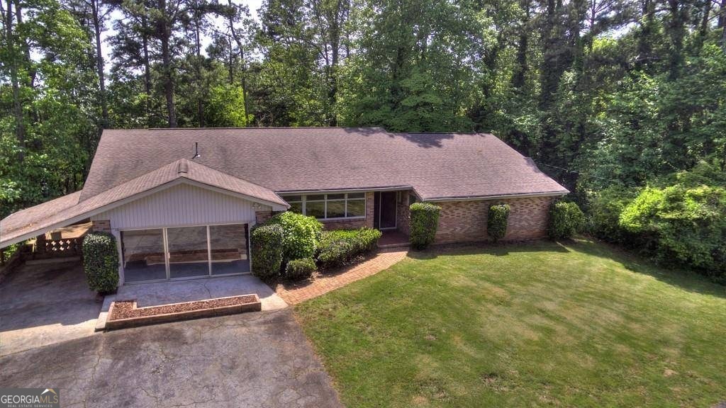 67 Polk Lane Dallas, GA 30132 - Photo 44 of 51 a house with trees in the background