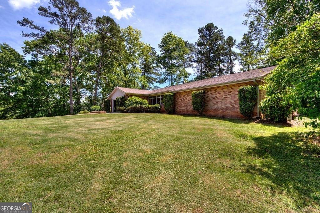 67 Polk Lane Dallas, GA 30132 - Photo 48 of 51 a view of a house with a yard