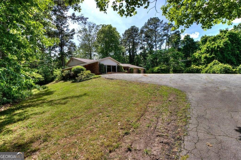 67 Polk Lane Dallas, GA 30132 - Photo 51 of 51 a view of a house with a yard and trees