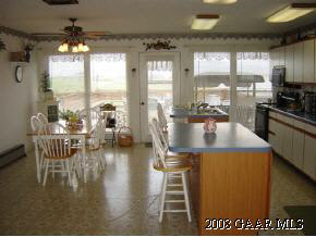 3715 Rockfish Road Grottoes, VA 24441 - Photo 5 of 12 a dining room with furniture a chandelier and wooden floor